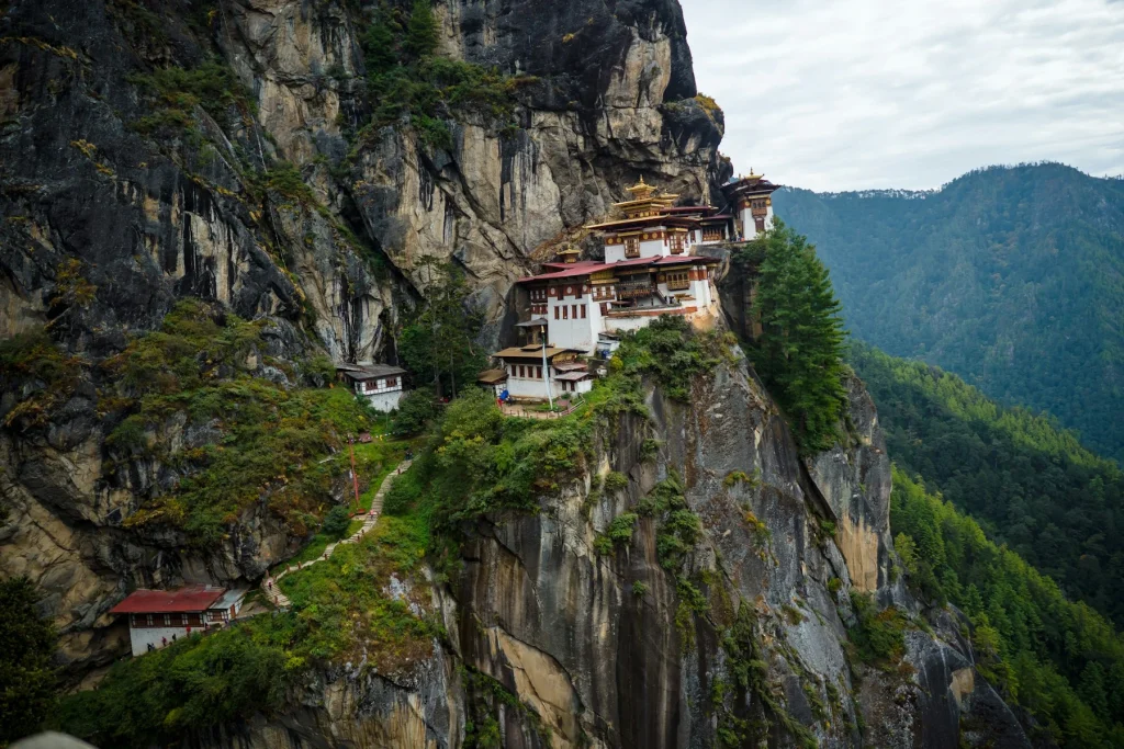 white and brown concrete house on top of mountain during daytime