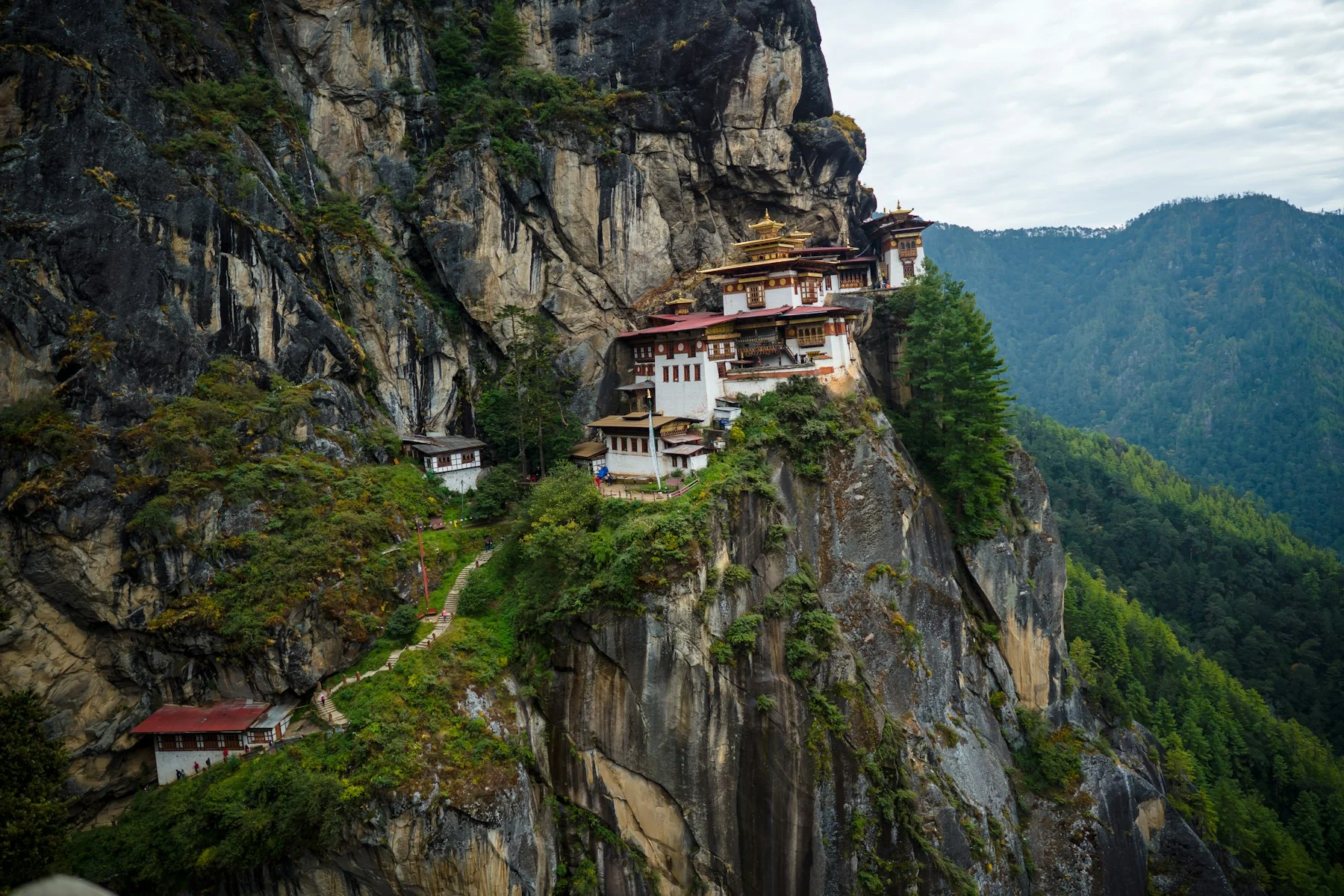white and brown concrete house on top of mountain during daytime