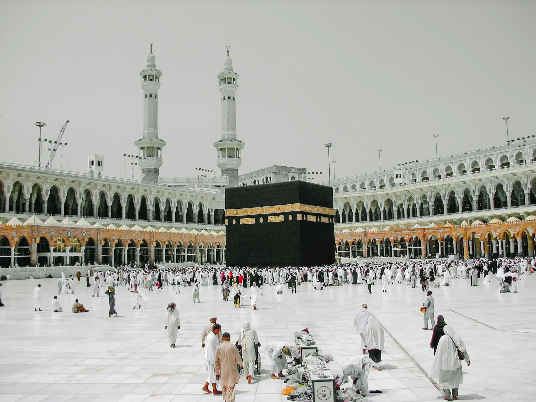 The Kaaba at the Masjid al-Haram in Mecca with pilgrims in the courtyard