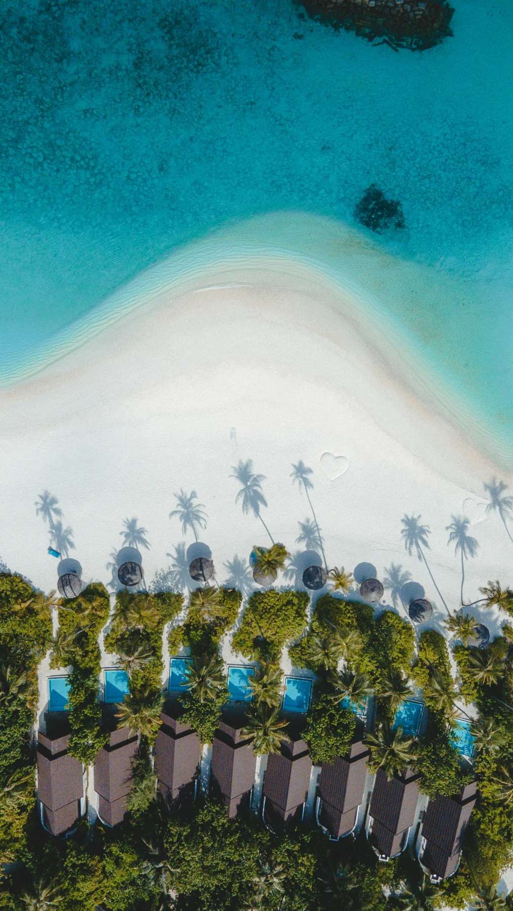 An aerial view of a beach and resort